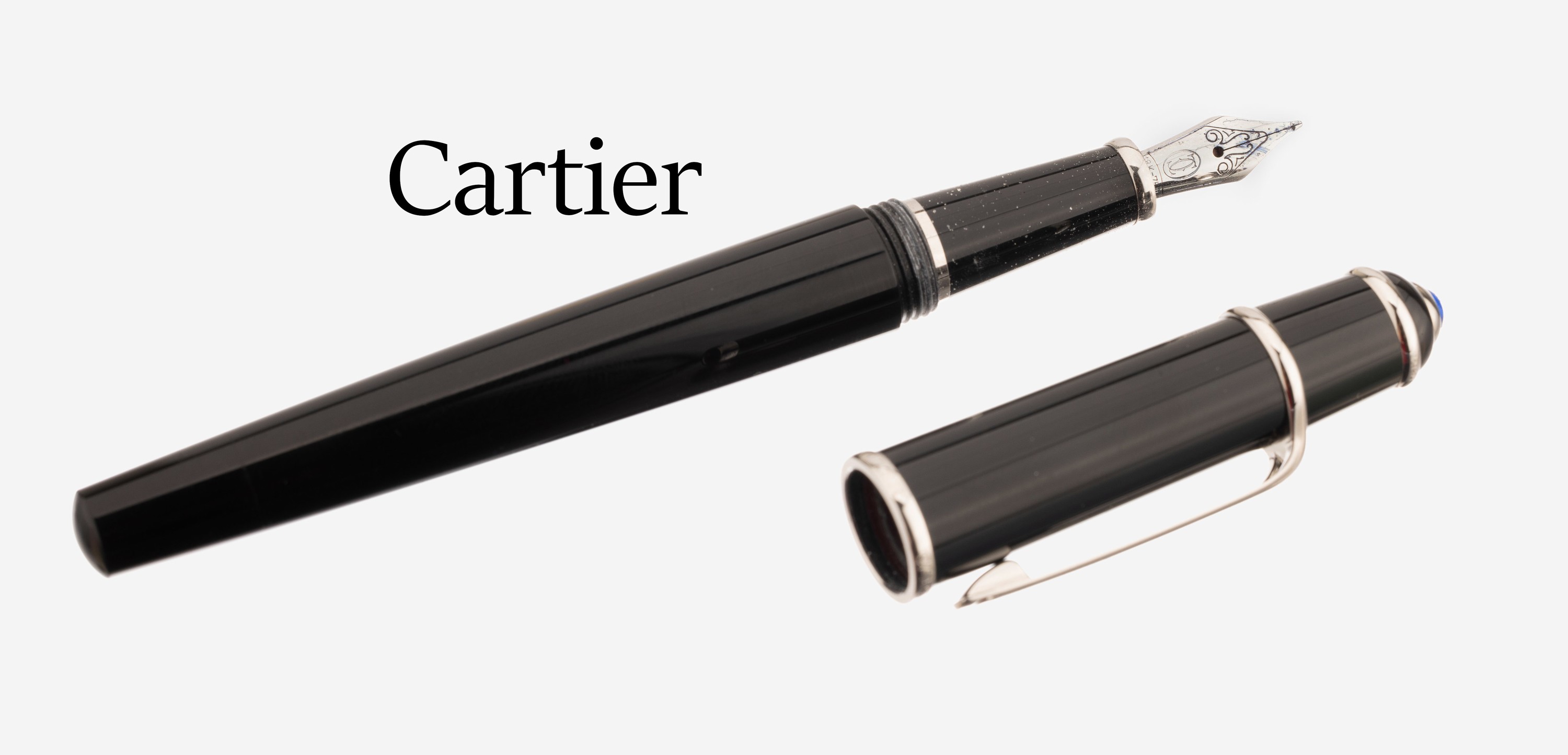 Detail a: CARTIER Füller, Modell Diablo, Korpus und Kappe schwarzer Hartlack, Feder WG 750/000, Kappe mit blauem Glascabochon, in Etui