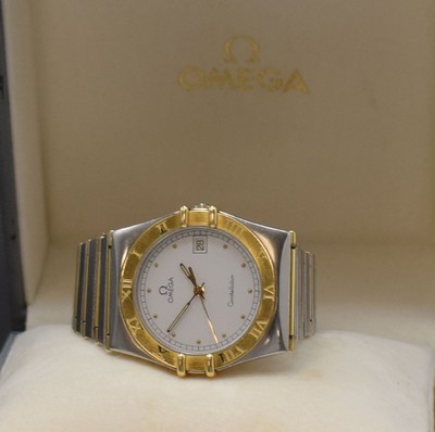 26747501e - OMEGA gents wristwatch Constellation reference 396.1070 / 396.1080, Switzerland around 1990, quartz, stainless steel/gold combined including bracelet with deployant clasp, snap on case back, bezel with engraved Roman indices, white dial, display of hours, minutes, sweep seconds and date, calibre 1441, diameter approx. 34 mm, length approx. 18,5 cm, original box, condition 2-3