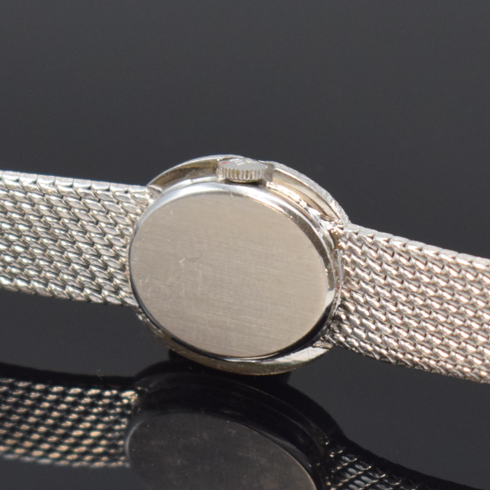 Detail c: EBEL diamantbesetzte Damenarmbanduhr in WG 750/000, Schweiz um 1970, Handaufzug, unsign. 2-tlg. Geh. m. integr. Milanaiseband, Boden aufgedr., silb. ...