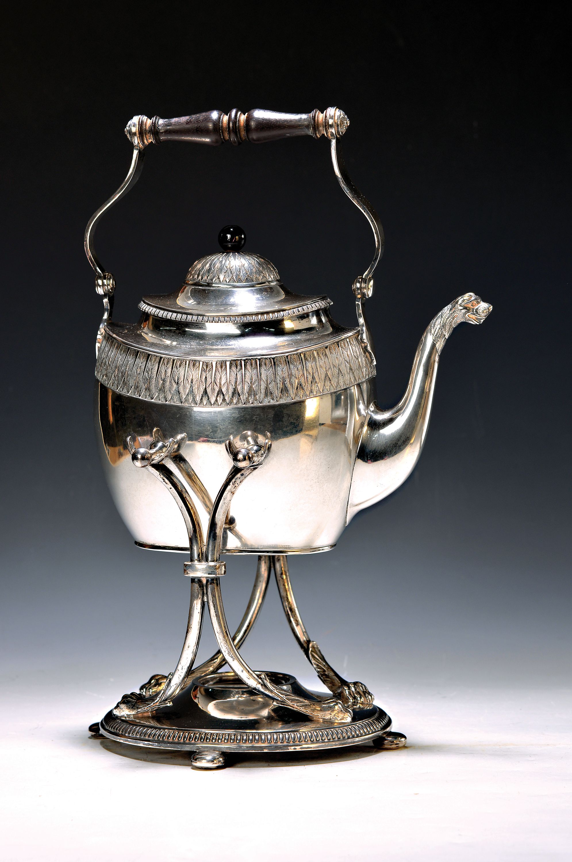 Silberne Teekanne mit Stövchen, Koch & Bergfeld, um 1900, 800er Silber, stil. Akantusblattdekor, Fabeltierausguss, gedrechselter Griffeinsatz, num. ...