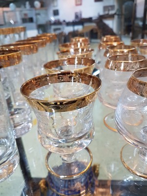 26748670d - Drinking glass service, Murano, 1960s/70s, 10 champagne glasses, 6 champagne bowls, 4 wine glasses, 6 cognac snifters, 6 tumblers, colorless glass, etched decor, gold rims, a few glasses without gold rims on the foot