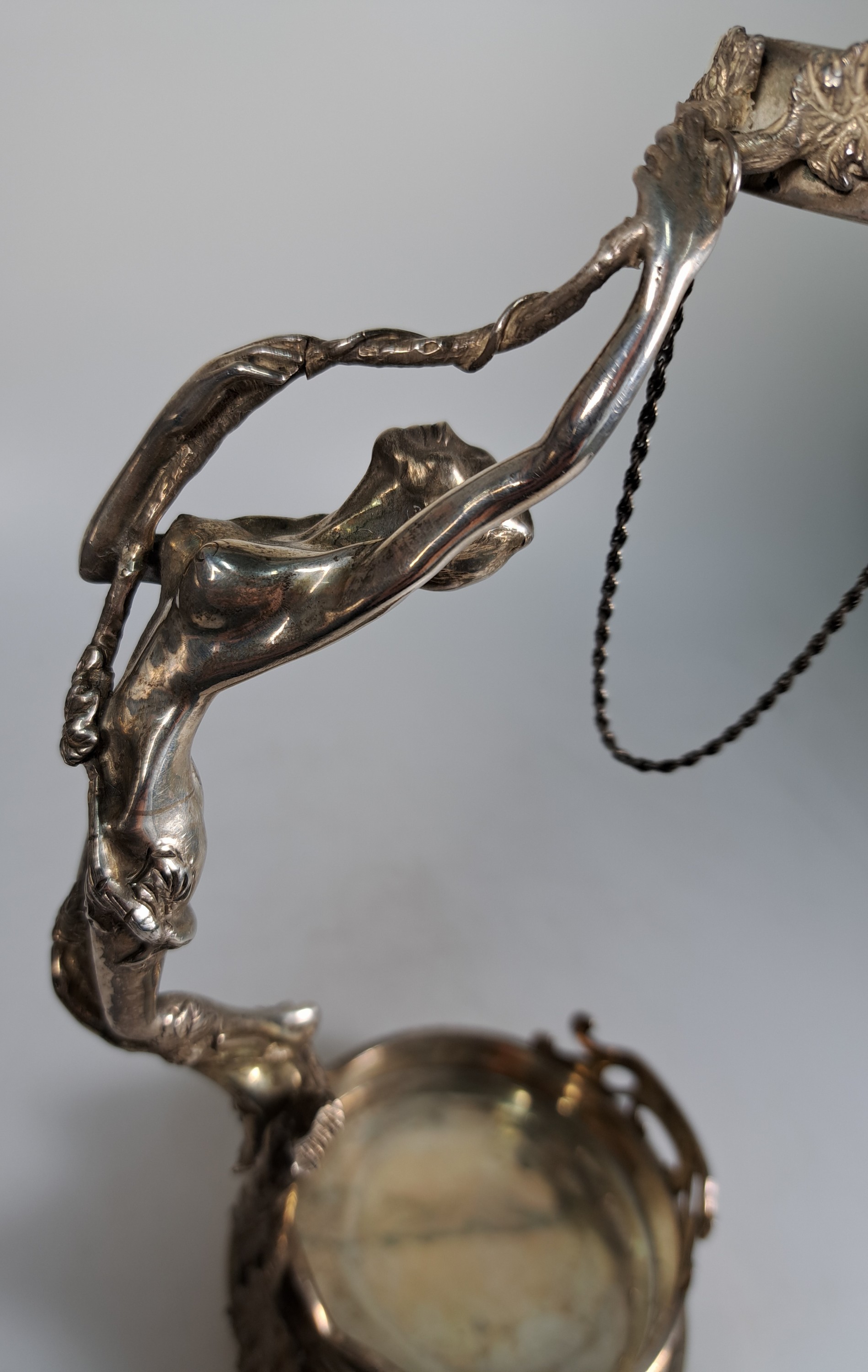 Detail d: Flaschenhalter, um 1900, Jugendstil, 925er Sterling Silber, mit vollplastischer Frauenfigur, H. ca. 27cm, ca. 570 g.