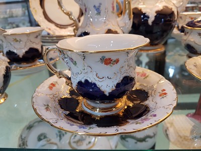 26750107d - Coffee service, Meissen, around the 1960s, B- shape, for 5 people, 5 coffee cups with saucers, 5 dessert plates, coffee pot, small coffee pot, sugar bowl, milk jug, partly decorated in cobalt blue, gold decoration and scattered flowers, 2nd choice, one pin on the inside of the lid is missing