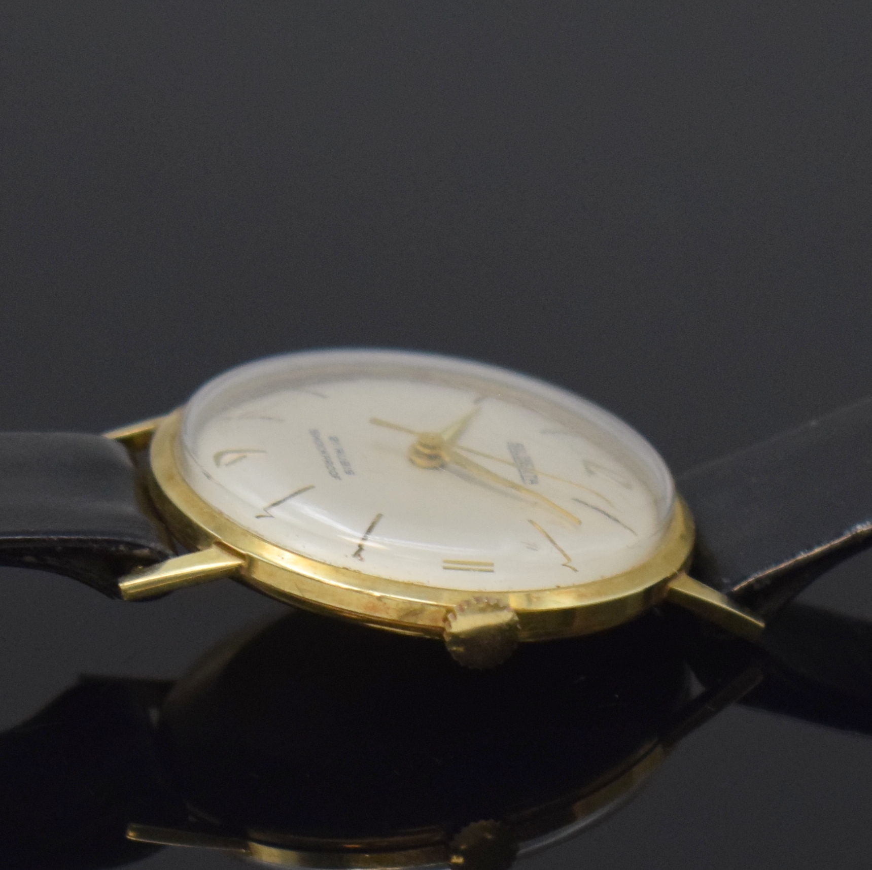 Detail b: SILBERTA Armbanduhr in GG 585/000, Deutschland um 1960, Handaufzug, dünnes Goldgeh. m. Metall-Innengeh., silb. Zifferbl., gold. Indizes u. Zeiger, ...