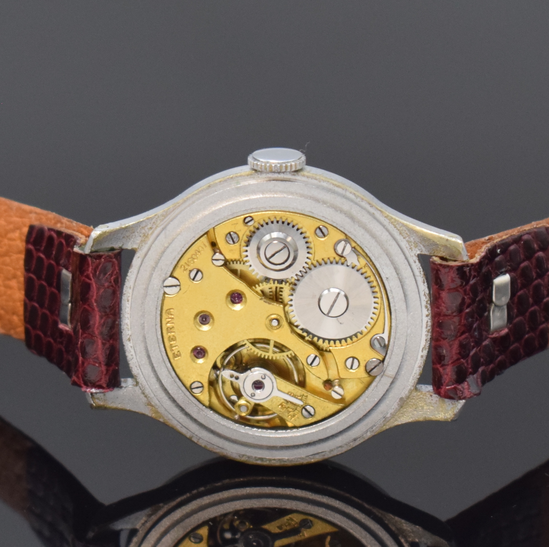 Detail d: ETERNA frühe Armbanduhr, Schweiz um 1930, Handaufzug, verchromtes Geh., Stahlboden aufgedr., silb. orig. Zifferbl. pat., arab. Zahlen, kl. Sek. b. ...