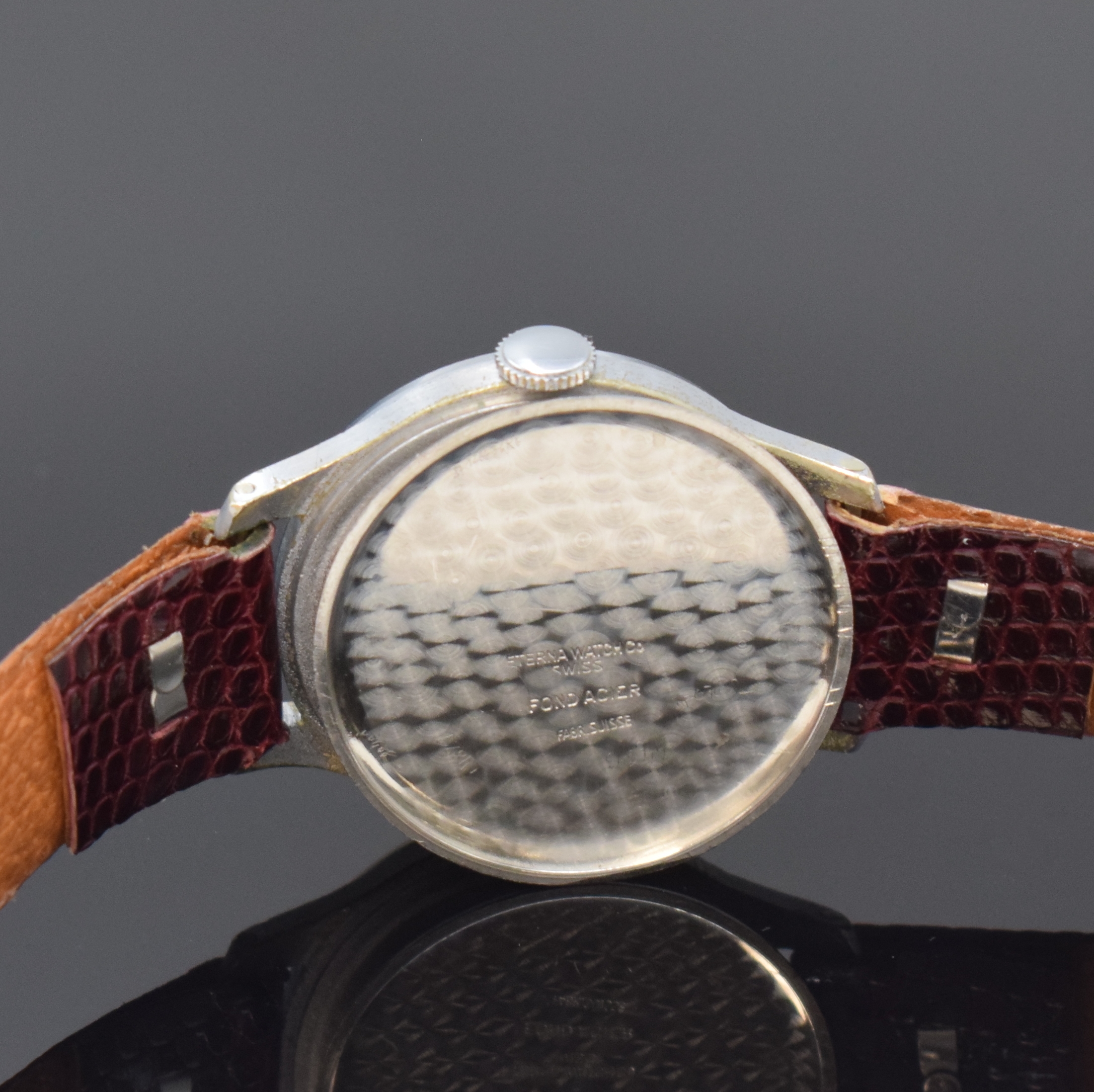 Detail e: ETERNA frühe Armbanduhr, Schweiz um 1930, Handaufzug, verchromtes Geh., Stahlboden aufgedr., silb. orig. Zifferbl. pat., arab. Zahlen, kl. Sek. b. ...