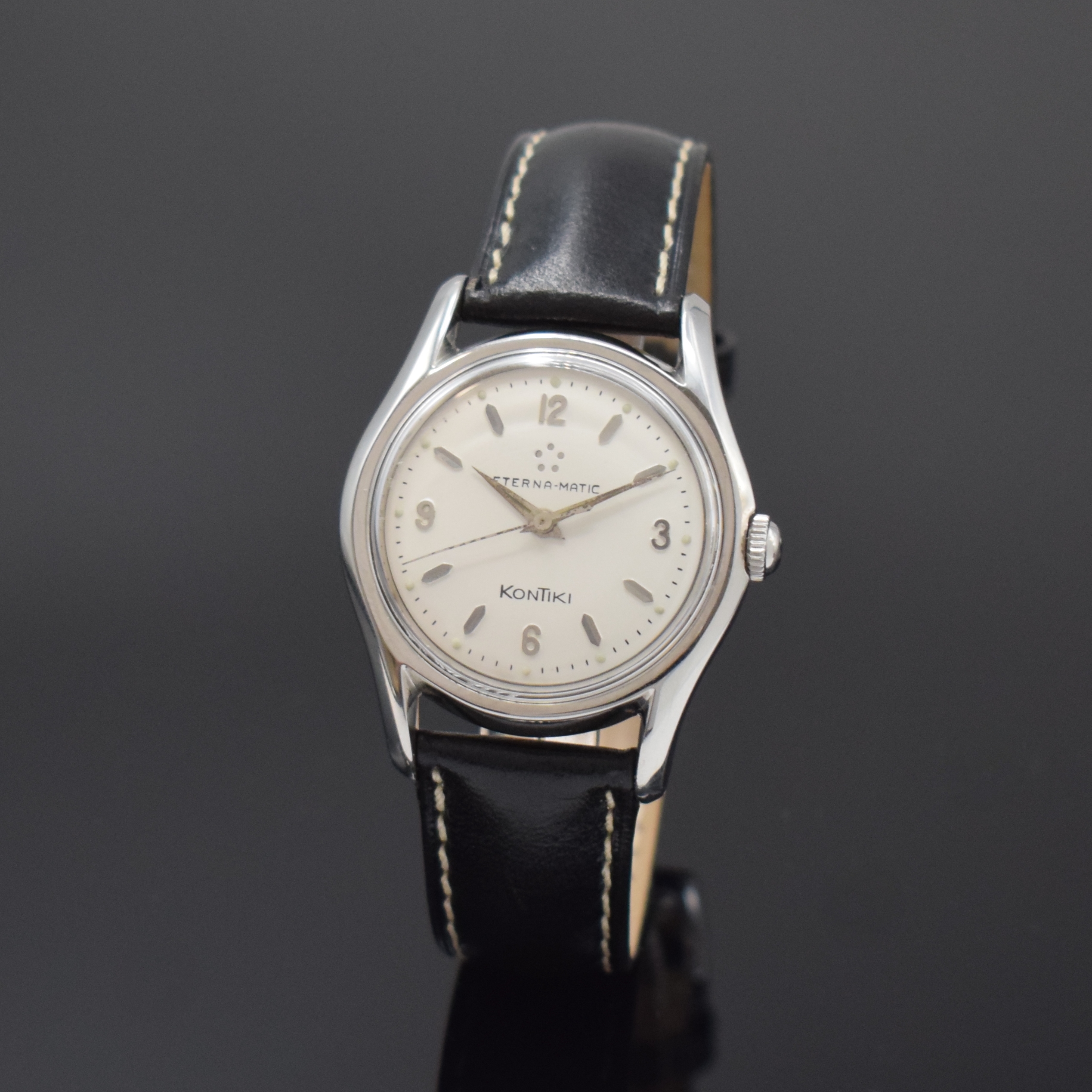 ETERNA-MATIC Kontiki Herrenarmbanduhr in Stahl, Schweiz um 1955, Automatik (Rotor fehlt), 2-tlg. Geh., verschr. Boden m. grav. Kontiki-Symbol, silb. ...