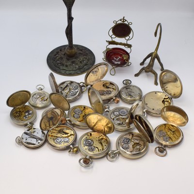 26754063d - 14 pocket watches and 3 Pocket watch stands, Switzerland/USA/Russia around 1880-1980, crown winding, 4x silver, 2 big 8 days, 1x complete calendar with moon phase, 1x Mickey Mouse, 2x holder has to be replaced (stand), diameter approx. 50-71 mm, partial not working, condition 2-4 more informations on request