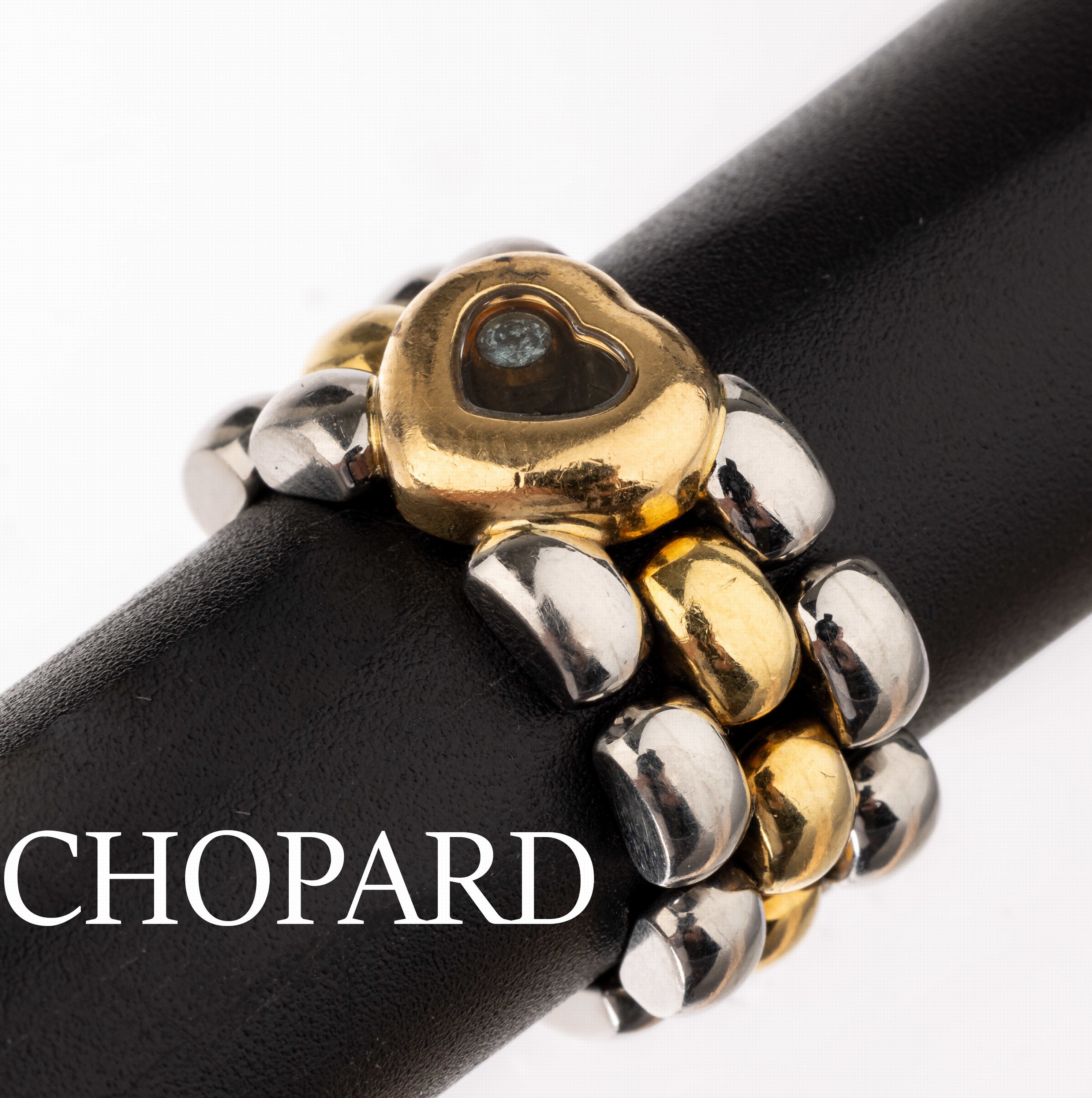18 kt Gold CHOPARD Brillant-Kettenring, GG/WG 750/000, 1 Brillant bewegl. hinter Glas ca. 0.05 ct Weiß/si, RW 55, sign.