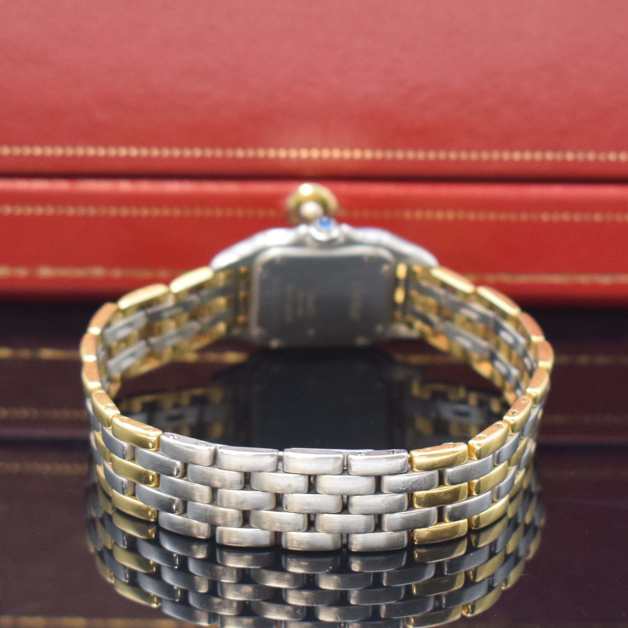 Detail b: CARTIER Panthere Damenarmbanduhr in Stahl/Gold, Schweiz um 1990, quarz, Boden 8-fach verschr., orig. Gliederband m. dopp. Faltschl., vers. Zifferbl. ...