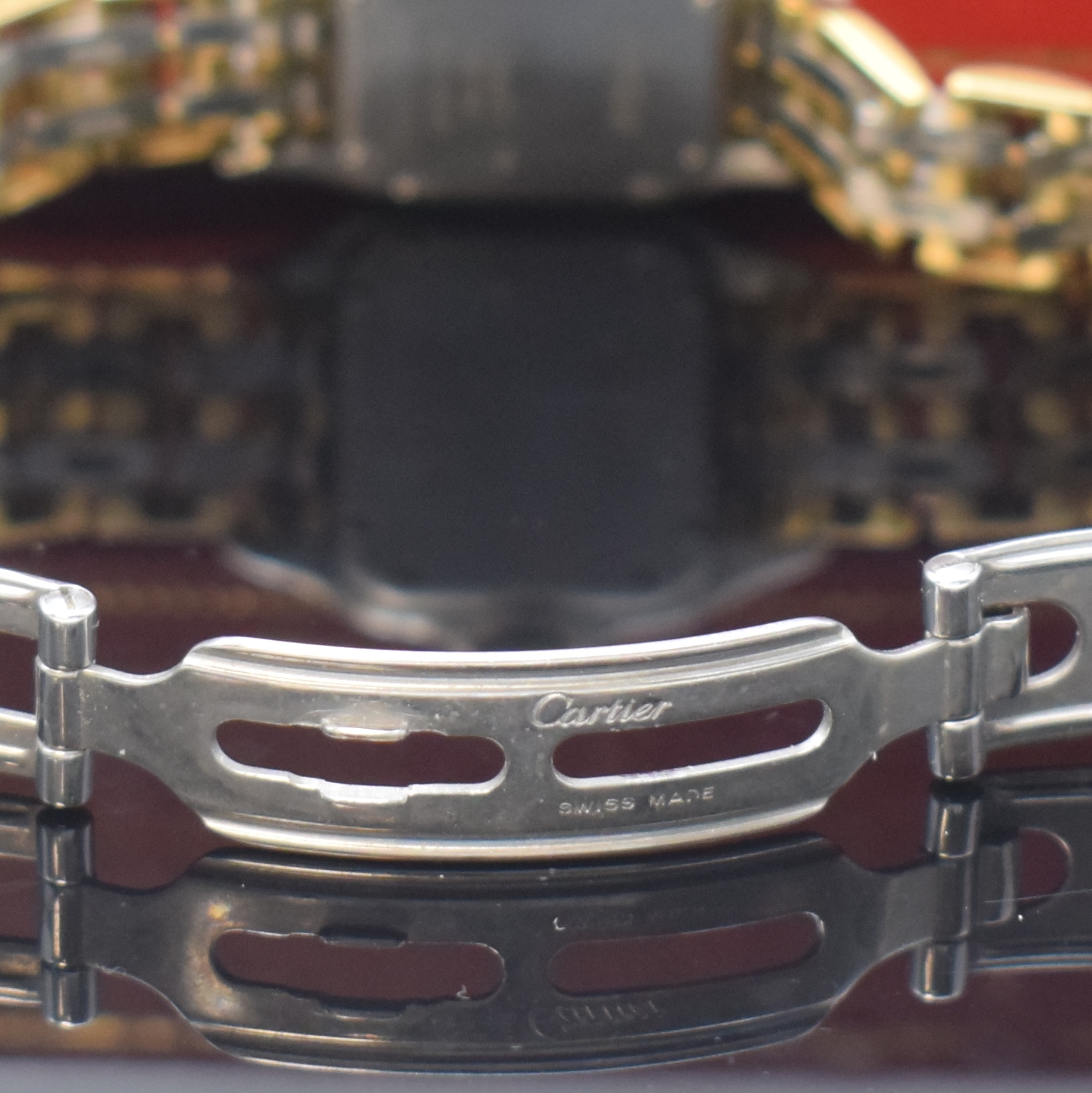 Detail c: CARTIER Panthere Damenarmbanduhr in Stahl/Gold, Schweiz um 1990, quarz, Boden 8-fach verschr., orig. Gliederband m. dopp. Faltschl., vers. Zifferbl. ...