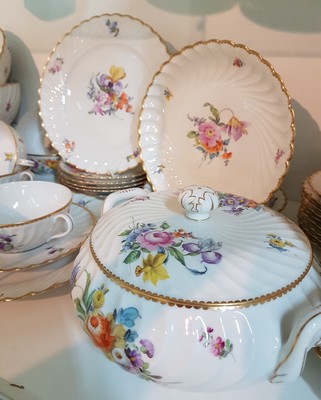 26755347a - Dinner service, Nymphenburg, wave shape, 20th century, porcelain, hand-painted decoration of scattered flowers and bouquets of flowers, gold rim, 8 soup bowls with utensils, 8 dinner plates, 8 bread plates, 2 small bowls, 2 side dish bowls, 2 gravy boats, lidded tureen, traces of age