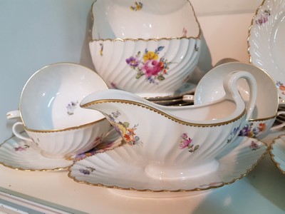 26755347f - Dinner service, Nymphenburg, wave shape, 20th century, porcelain, hand-painted decoration of scattered flowers and bouquets of flowers, gold rim, 8 soup bowls with utensils, 8 dinner plates, 8 bread plates, 2 small bowls, 2 side dish bowls, 2 gravy boats, lidded tureen, traces of age