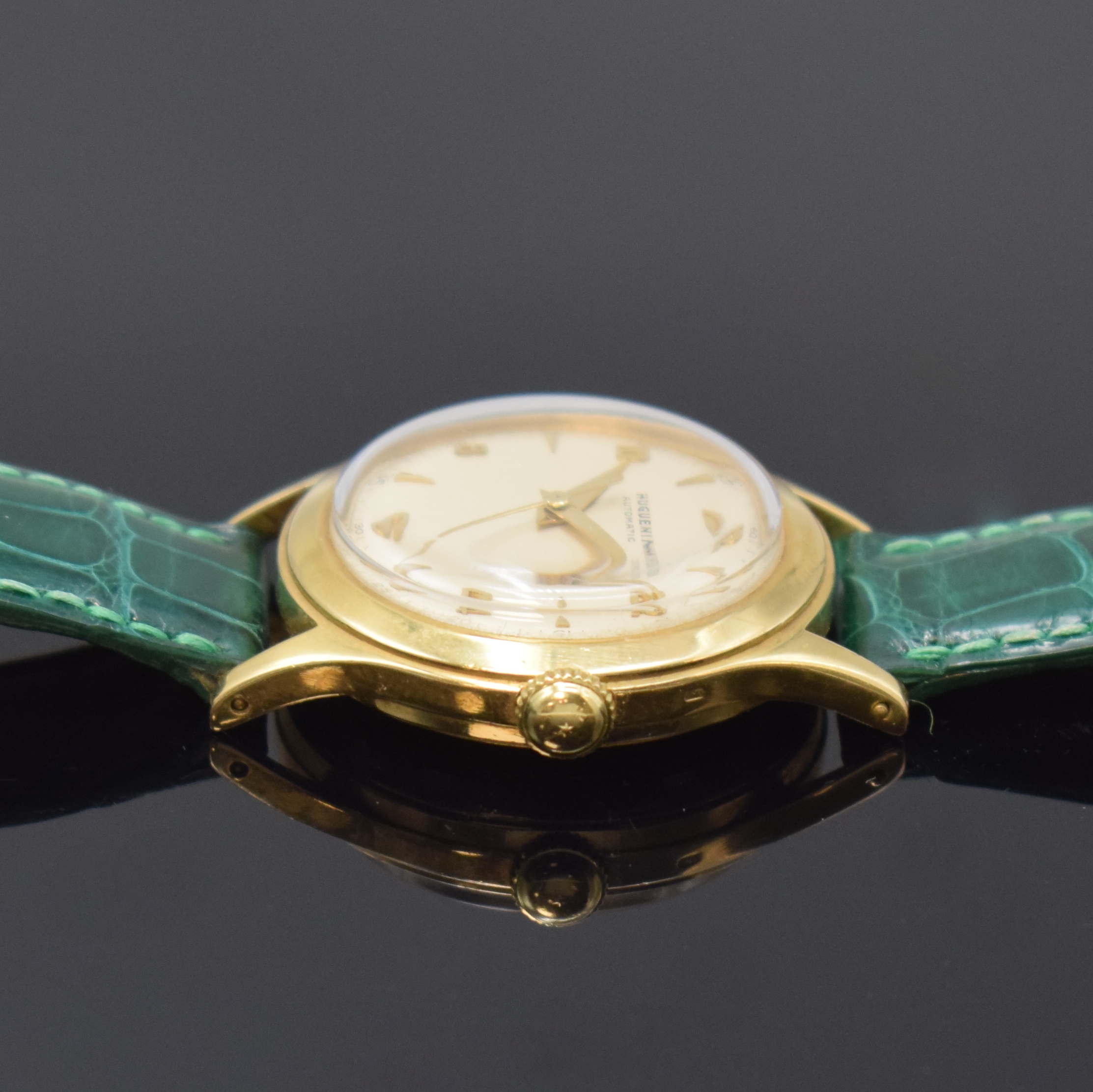 Detail b: HUGUENIN Automatic verschraubte Armbanduhr in GG 750/000, Schweiz um 1955, massives 2-tlg. Geh., silb. orig. Zifferbl., aufges. gold. Indizes, gold. ...