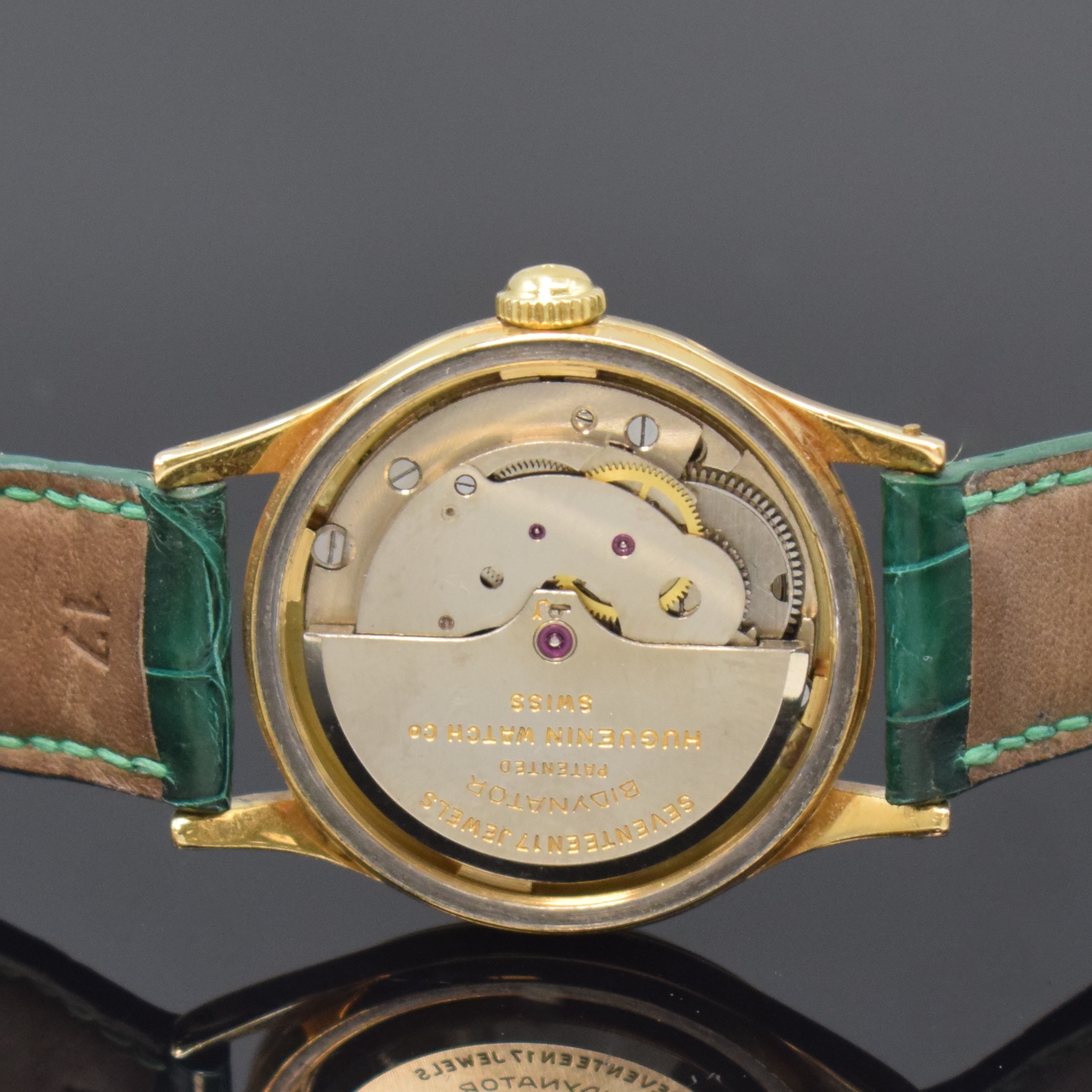 Detail d: HUGUENIN Automatic verschraubte Armbanduhr in GG 750/000, Schweiz um 1955, massives 2-tlg. Geh., silb. orig. Zifferbl., aufges. gold. Indizes, gold. ...