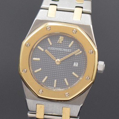 26759568a - AUDEMARS PIGUET Royal Oak wristwatch in steel/gold, Switzerland around 1990, quartz, 8-times screwed down case, integrated original steel/gold bracelet with deployant clasp, gray tapestry dial with applied luminous indices, gilded luminous hands, date at 3, diameter approx. 30 mm, length approx. 17,5 cm, condition 2-3