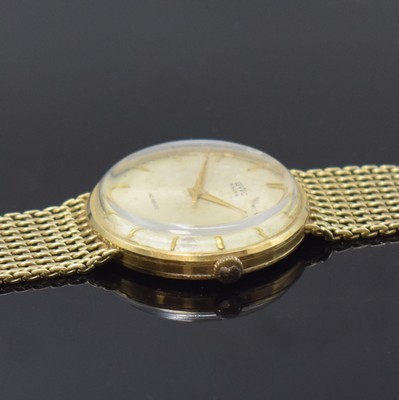 26759743c - BWC 14k yellow gold gents wristwatch, Switzerland around 1960, manual winding, 3- piece construction case with fixed bracelet, snap on case back and bezel, silvered dial patinated, gilded indices and hands, sweep seconds, nickel plated movement calibre ETA 2391, 17 jewels, diameter approx. 33 mm, length approx. 18,5 cm, weight approx. 54g, needs to be overhauled, condition 3