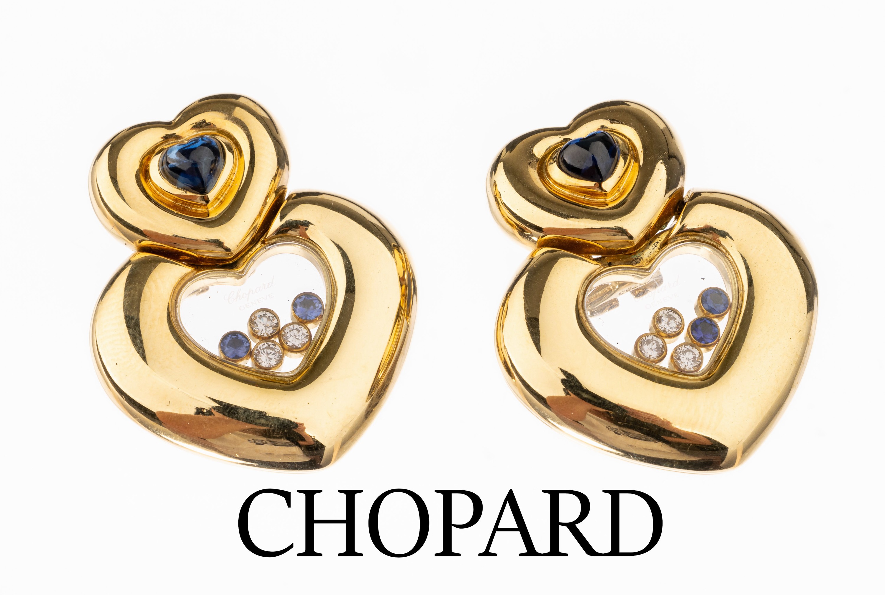 Paar 18 kt Gold CHOPARD Brillant-Saphir- Ohrstecker, GG 750/000, aus der Serie HappyDiamonds, 2 herzf. Saphir-Cabochons zus. ca. 1.00 ct, bewegl. ...