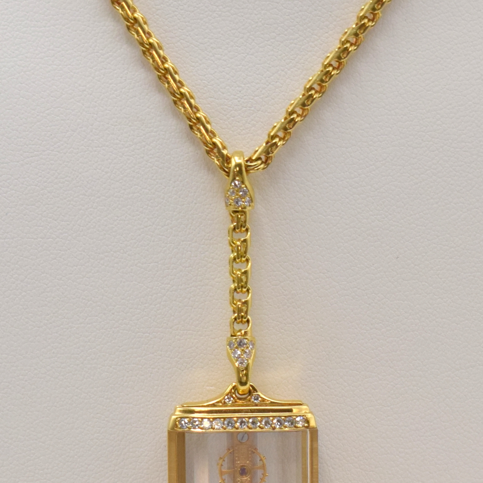 Detail d: CORUM Golden Bridge sehr seltene Anhängeuhr in GG 750/000 mit Brillanten, Schweiz um 1990, Handaufzug, 4-fach verschr. Geh. an Kette (teilw. m. ...