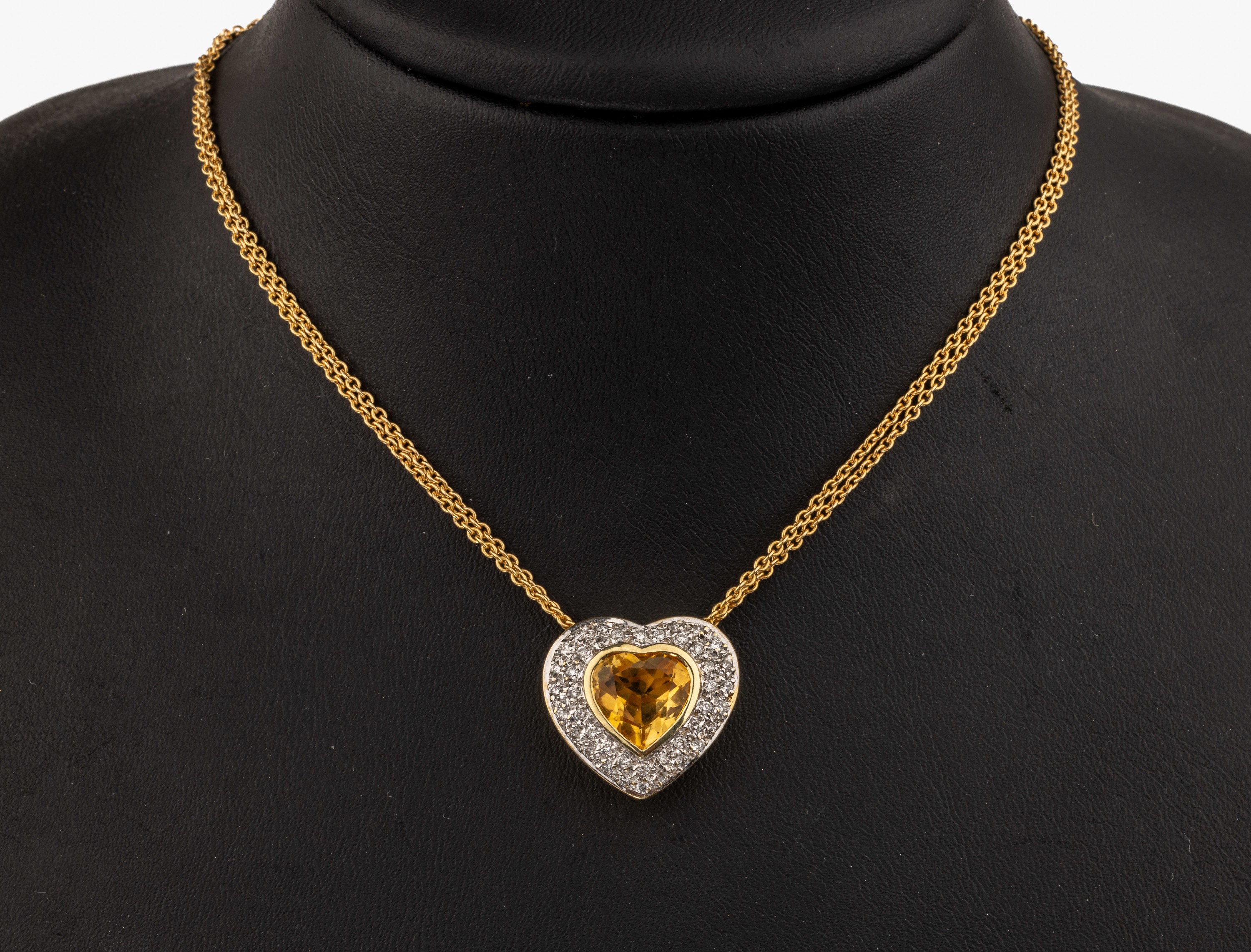 14 kt Gold Citrin-Brillant-Anhänger, GG 585/000, Herz, mittig facett. Citrin-Herz ca. 4.00 ct, umgeben von 41 Brillanten in rhod. Fassung ca. 0.41 ...