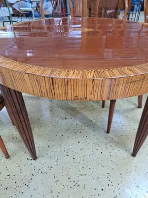 26760749d - Dining table with six chairs, Art Deco, around 1920, mahogany veneer table top, frieze and frame, as well as the backs of the chairs veneered with zebra wood, extendable table, central table surface with decorative medallion, chairs with seat upholstery, approx. 72 x 130 x 110 cm , Chair: H. approx. 95 cm, Sh. approx. 45 cm, condition 2