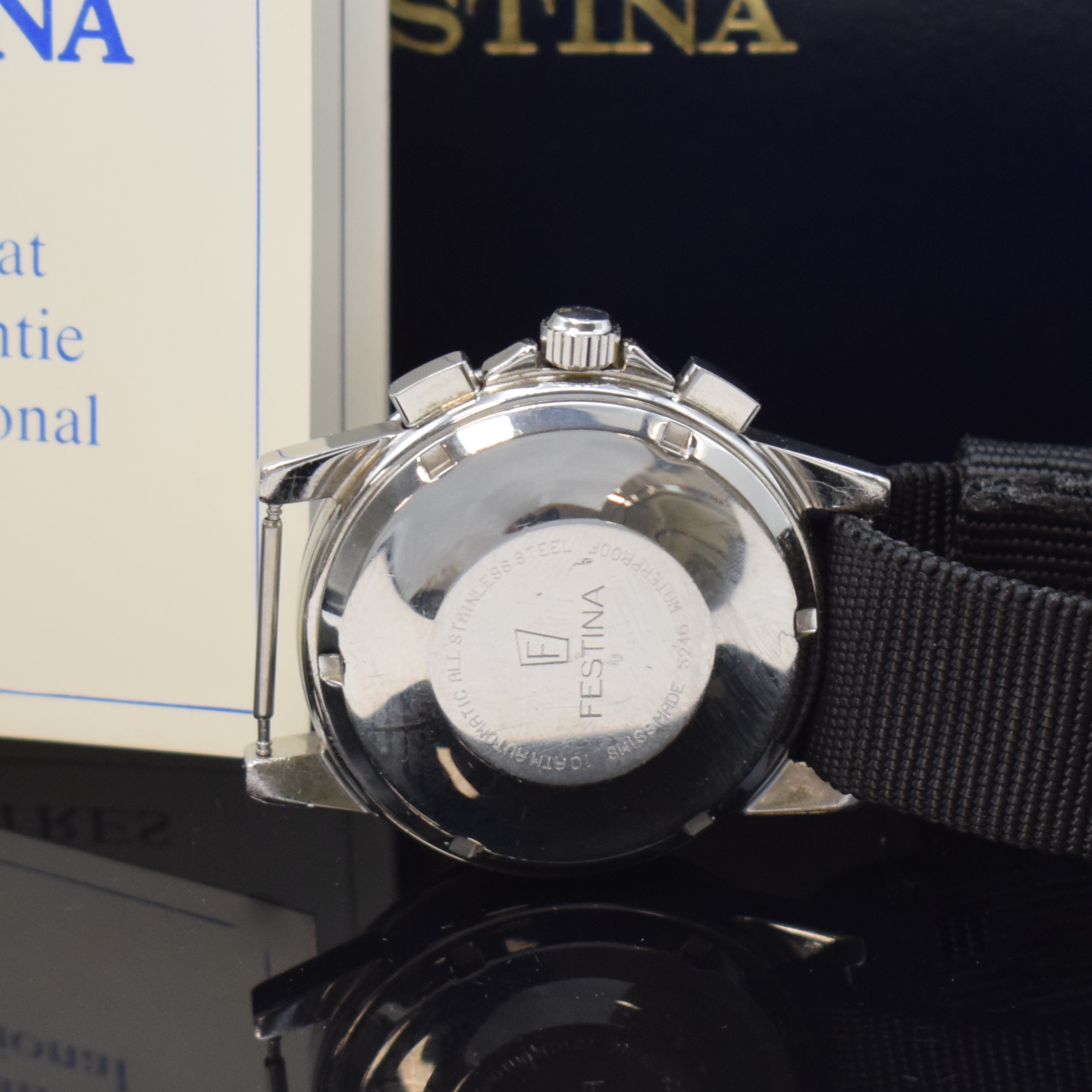 Detail c: FESTINA Armbandchronograph in Stahl, Schweiz verk. lt. beil. Pap. 08/1993, Automatik, Boden u. Krone verschr., rotes Zifferbl., silb. Hilfsblätter, ...
