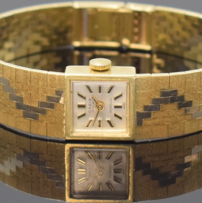 26762220a - CARIB 14k yellow gold ladies wristwatch, Switzerland around 1970, manual winding, snap on case back, silvered dial with applied hour-indices, gilded hands, calibre AS 1977, 17 jewel, measures approx. 14 x 14 mm, length approx. 17 cm, weight approx. 35g, needs to be overhauled, condition 2