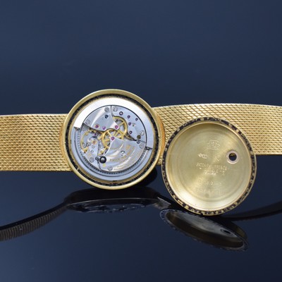 26762562e - PATEK PHILIPPE / GÜBELIN fine 18k yellow gold gents wristwatch reference 3563/3, self winding, Switzerland 1975, milanaise bracelet, so called Backwinder, hand-setting on the back side, screwed down case back, gilded structured dial with raised indices, display of hours, minutes and sweep seconds, rhodium plated movement, calibre 350, Seal of Geneva, 28 jewels, fausses cotes decoration, Gyromax- balance, adjusted in 5 positions, Breguet- hairspring, diameter approx. 35 mm, length approx. 17,5 cm, signs of use due to age, overhaul recommended at buyer's expense, condition 2-3