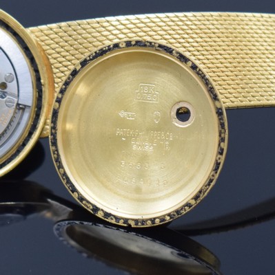 26762562g - PATEK PHILIPPE / GÜBELIN fine 18k yellow gold gents wristwatch reference 3563/3, self winding, Switzerland 1975, milanaise bracelet, so called Backwinder, hand-setting on the back side, screwed down case back, gilded structured dial with raised indices, display of hours, minutes and sweep seconds, rhodium plated movement, calibre 350, Seal of Geneva, 28 jewels, fausses cotes decoration, Gyromax- balance, adjusted in 5 positions, Breguet- hairspring, diameter approx. 35 mm, length approx. 17,5 cm, signs of use due to age, overhaul recommended at buyer's expense, condition 2-3