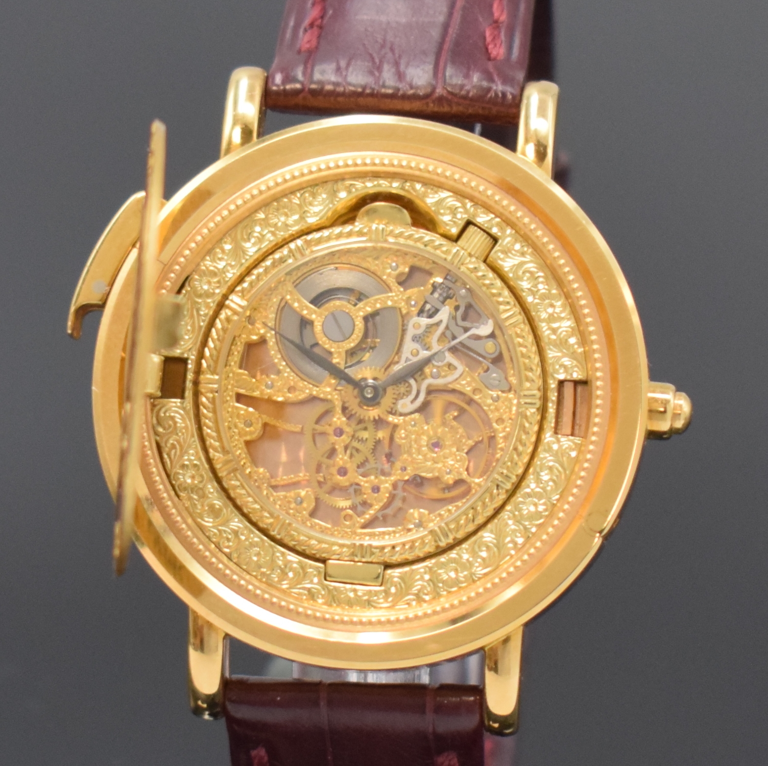 Detail a: KURT SCHAFFO seltene Twenty Dollars Münzarmband-/Taschenuhr mit skelettiertem Werk, Schweiz um 1995, Handaufzug, Geh. in GG 750/000, Lederband m. ...