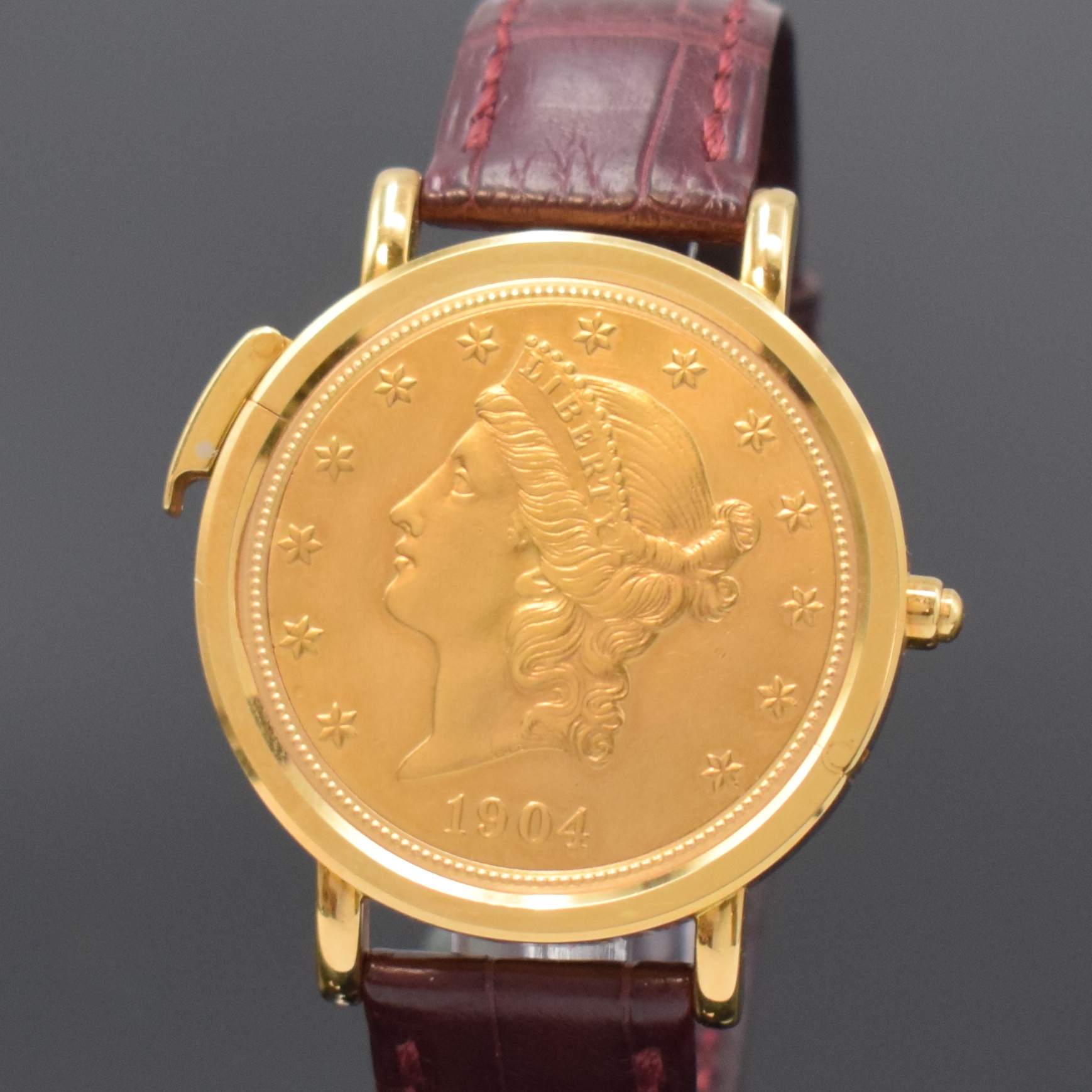 Detail b: KURT SCHAFFO seltene Twenty Dollars Münzarmband-/Taschenuhr mit skelettiertem Werk, Schweiz um 1995, Handaufzug, Geh. in GG 750/000, Lederband m. ...