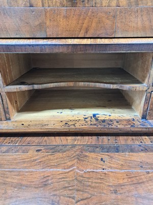 26764538b - Secretary, Louis-Seize, France, around 1780, walnut veneer, partly walnut root, 2 drawers at the bottom, one drawer and 2 blind drawers, roller flap with pull-out writing board, interior division with another 4 drawers, brass fittings, approx. 116x113x52 cm, condition 2-3