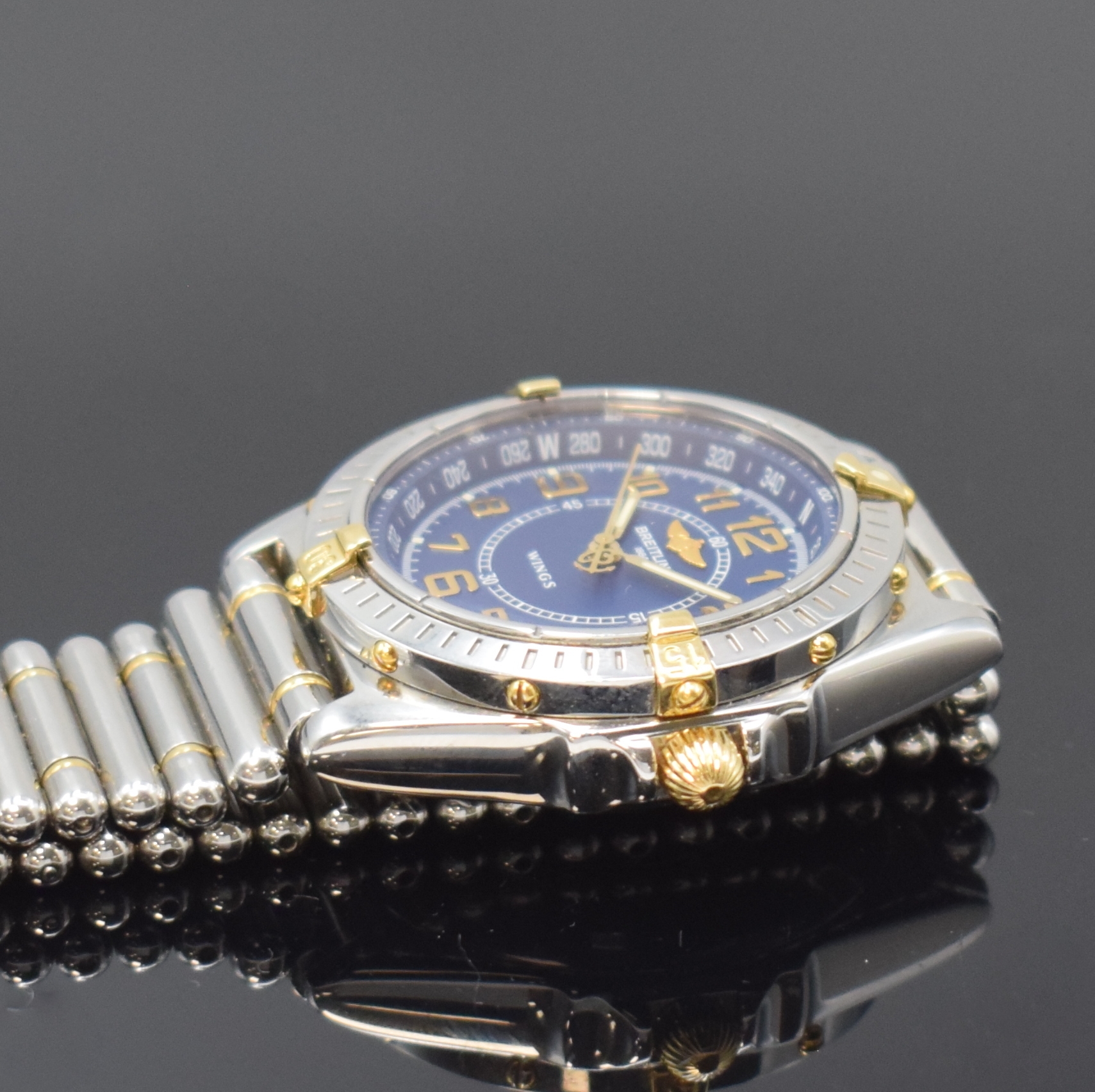 Detail c: BREITLING Herrenarmbanduhr Modellserie Wings Referenz B66050, Schweiz um 1998, quarz, z. T. verg. Edelstahlgeh. inkl. orig. Gliederband m. dopp. ...