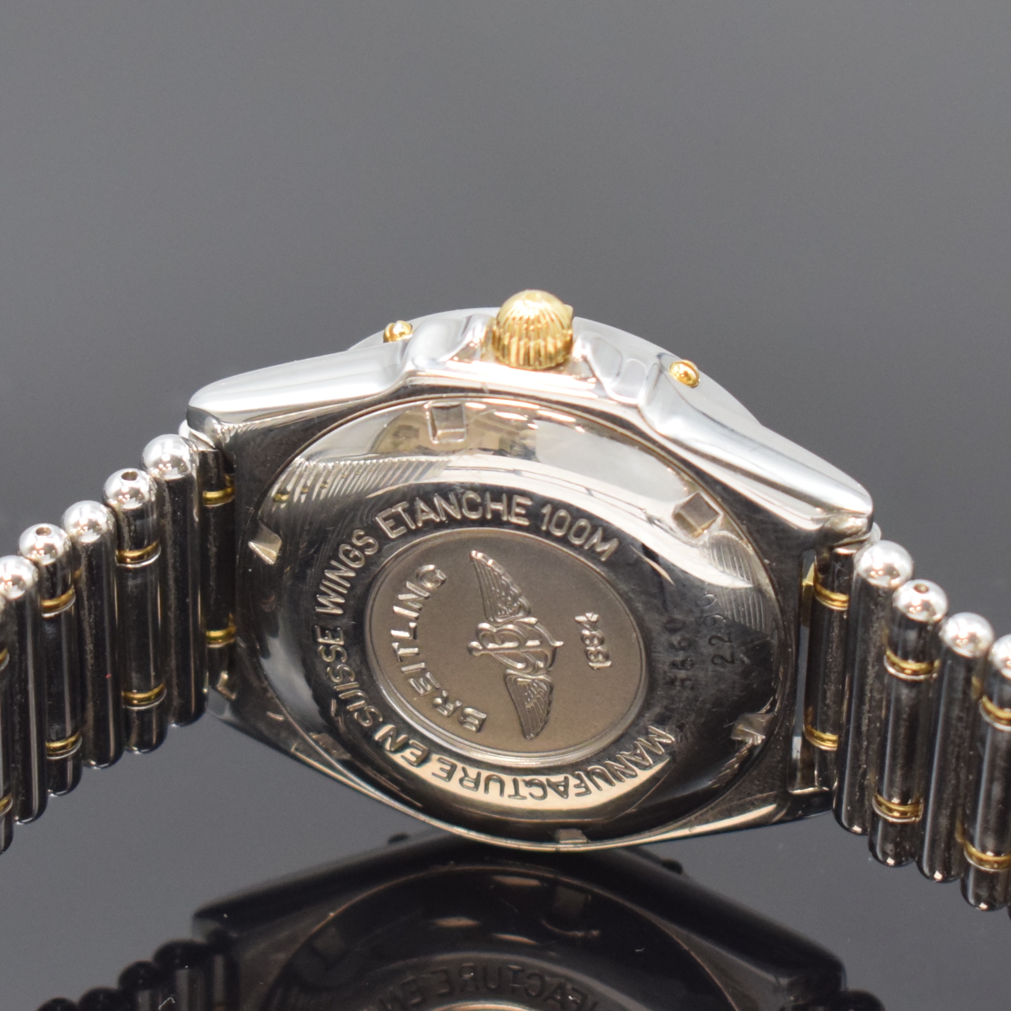 Detail d: BREITLING Herrenarmbanduhr Modellserie Wings Referenz B66050, Schweiz um 1998, quarz, z. T. verg. Edelstahlgeh. inkl. orig. Gliederband m. dopp. ...