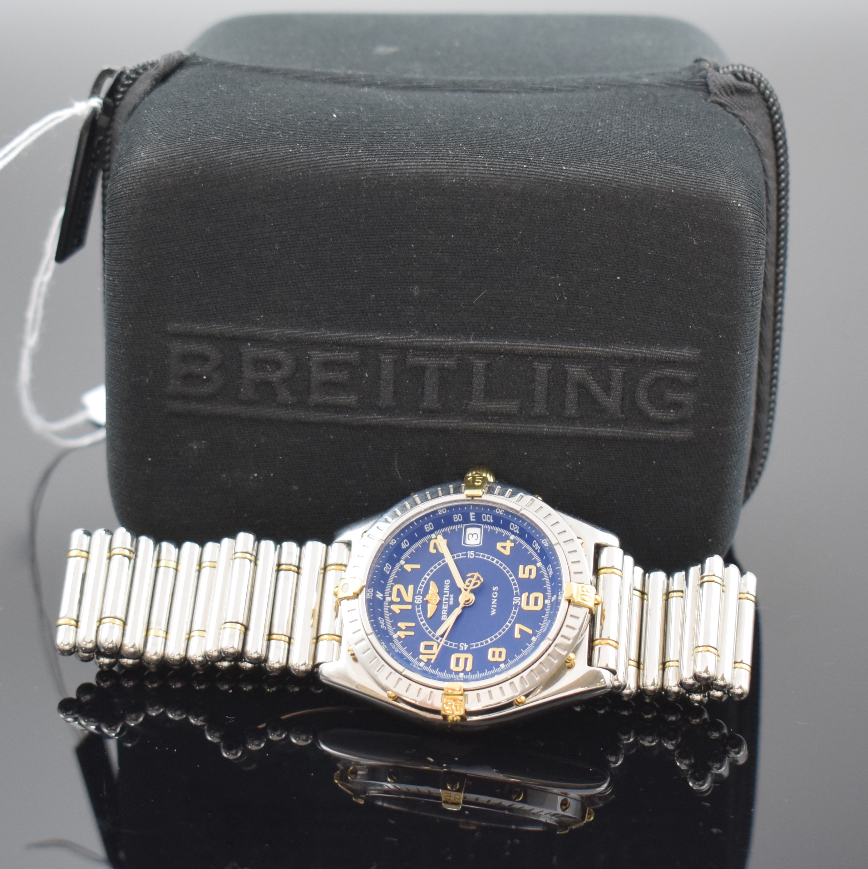 Detail e: BREITLING Herrenarmbanduhr Modellserie Wings Referenz B66050, Schweiz um 1998, quarz, z. T. verg. Edelstahlgeh. inkl. orig. Gliederband m. dopp. ...