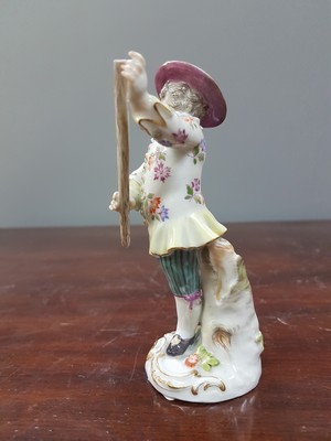 26765613d - Porcelain figure, Meissen, early 20th century, on staff and hat slightly dam., porcelain, colorfully painted, gold decoration, height approx. 11.5 cm