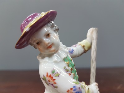26765613e - Porcelain figure, Meissen, early 20th century, on staff and hat slightly dam., porcelain, colorfully painted, gold decoration, height approx. 11.5 cm