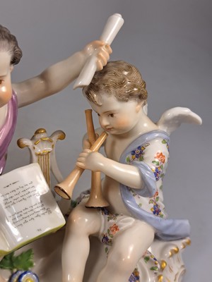 26765618n - Porcelain group, Meissen, around 1890/1900, allegory of poetry, designed by Johann Joachim Kaendler, two musical cupids, model no. 2464, fine polychrome painting, gold decoration, pommel swords, approx. 12.5 x 16 cm