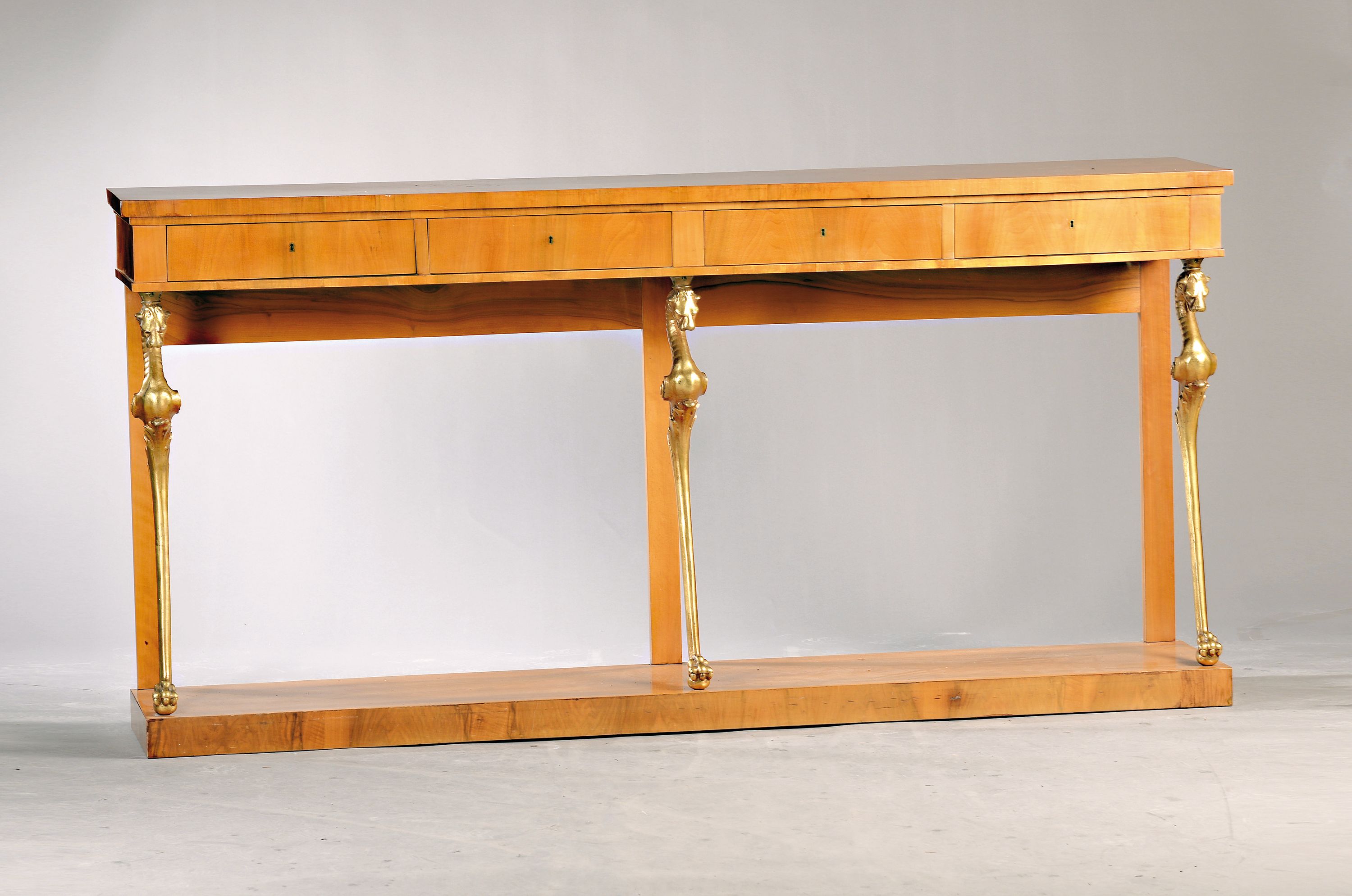Konsole/Anrichte, im Biedermeier-Stil, um 1900, Nußbaumfurnier, 4 Schubladen, Korpus wird getragen von vergoldeten fabelwesenartigen Seepferdchen, ...