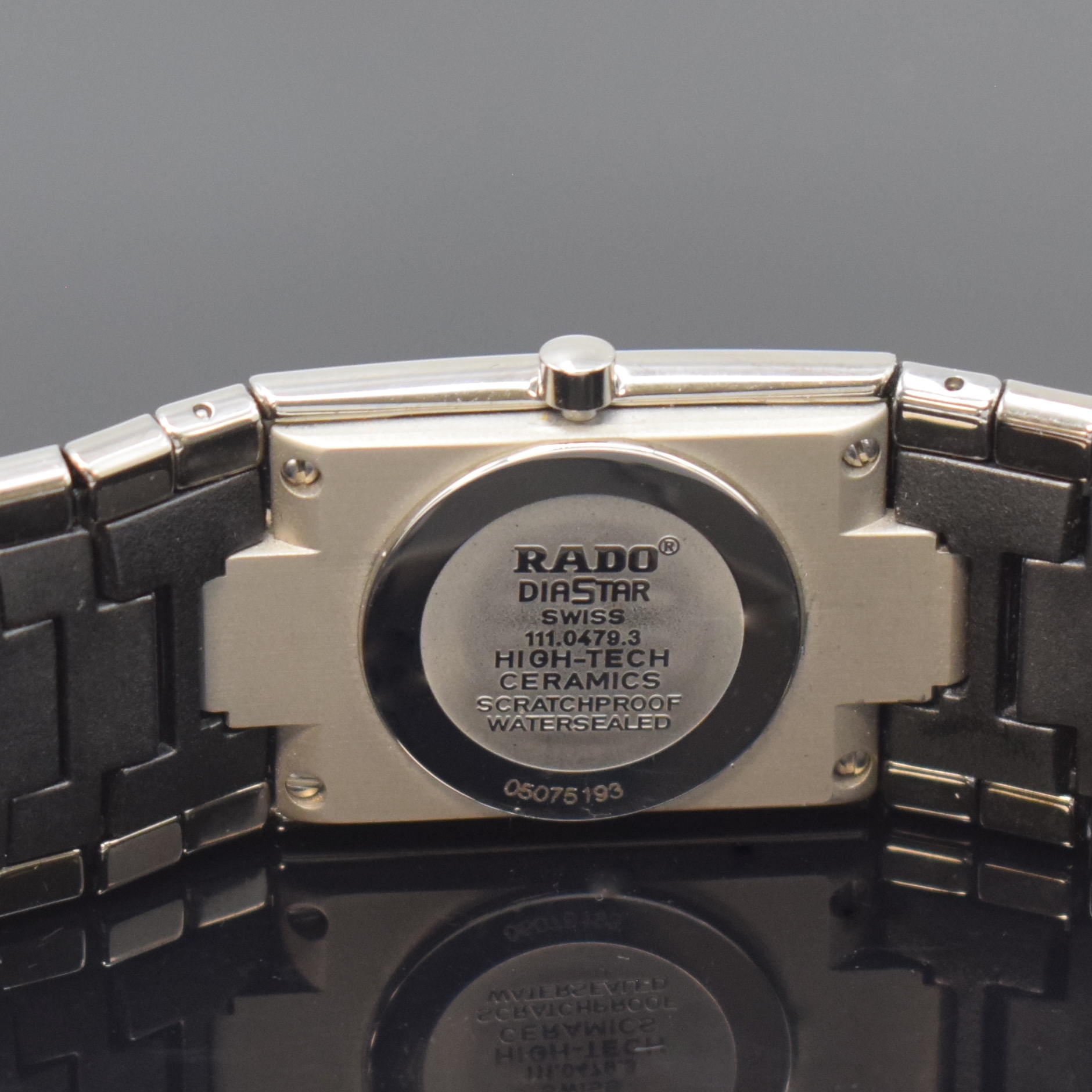 Detail c: RADO Diastar Armbanduhr Referenz 111.0479.3, Schweiz um 2005, quarz, High-Tech-Keramikgeh. inkl. Gliederband m. dopp. Faltschl. in Titan, Boden ...