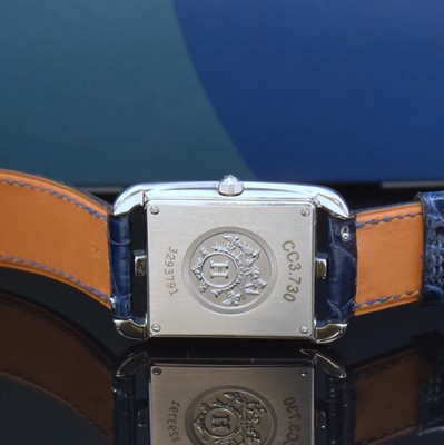 26766824d - HERMES wristwatch series Cape Cod reference CC3.730, quartz, stainless steel case including original leather strap with original buckle, case back screwed-down 4- times, case at the sides with diamonds, lapis lazuli-dial with Arabic numerals, silvered hands, measures approx. 40,5 x 29 mm, Hermes storage back enclosed, unworn stock, condition 1-2