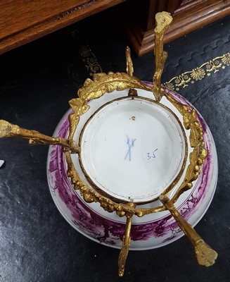 26768048i - Magnificent bowl on a bronze stand, Meissen, painting probably Bonaventura Gottlieb Häuer, around 1745/50, porcelain, camaieu painting in purple, pastoral landscape all around, inside base with picture cartouche, masterly depth perspective, gold edges, gold-plated bronze fittings, mouth edge restored, D. 15.5 cm, slight traces of age