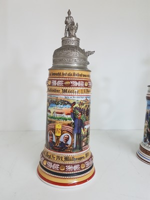 26768692a - 4 reservist steins, 1 of Nassau Field Artillery Regiment Frankfurt, 1 of Infantry Regiment Freiburg i.Br., 1 if Guard Field Artillery Regiment Berlin, 1 of Baden Infantry Regiment Mühlhausen, 1901-1913, porcelain, polychrome lithographed and painted, Lithophane in the base, tin lid with figurative attachment, Mühlhausen 1911-13 with hairline crack, signs of age, height approx. 28 cm