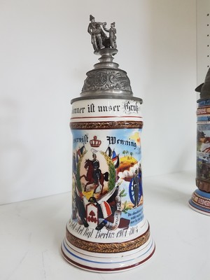 26768692c - 4 reservist steins, 1 of Nassau Field Artillery Regiment Frankfurt, 1 of Infantry Regiment Freiburg i.Br., 1 if Guard Field Artillery Regiment Berlin, 1 of Baden Infantry Regiment Mühlhausen, 1901-1913, porcelain, polychrome lithographed and painted, Lithophane in the base, tin lid with figurative attachment, Mühlhausen 1911-13 with hairline crack, signs of age, height approx. 28 cm