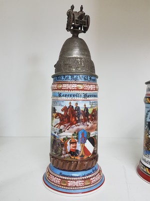 26768692g - 4 reservist steins, 1 of Nassau Field Artillery Regiment Frankfurt, 1 of Infantry Regiment Freiburg i.Br., 1 if Guard Field Artillery Regiment Berlin, 1 of Baden Infantry Regiment Mühlhausen, 1901-1913, porcelain, polychrome lithographed and painted, Lithophane in the base, tin lid with figurative attachment, Mühlhausen 1911-13 with hairline crack, signs of age, height approx. 28 cm