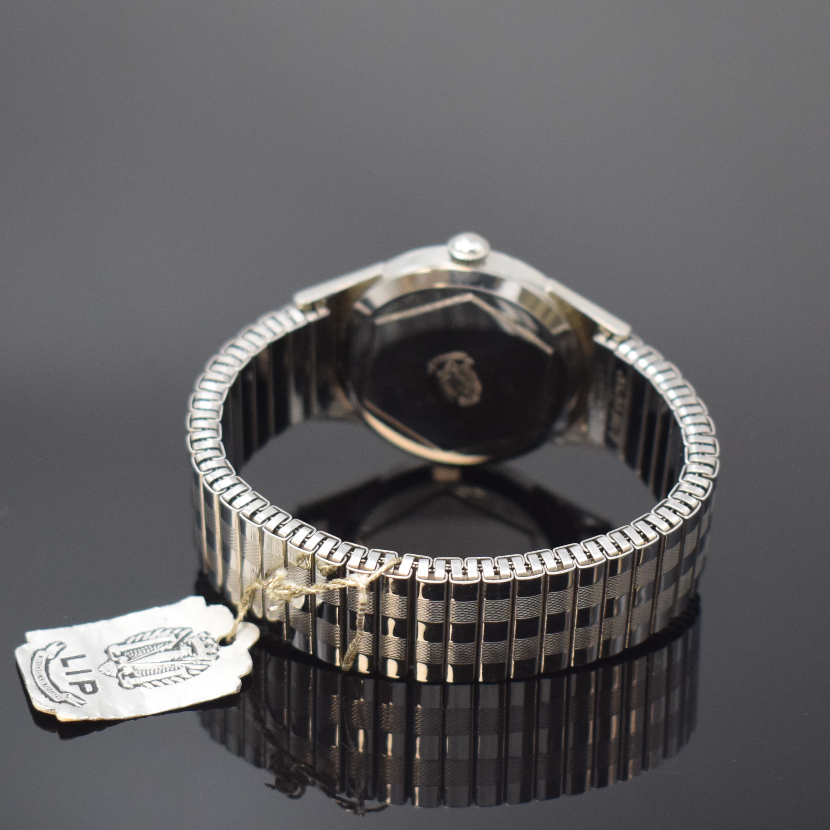Detail b: LIP nahezu neuwertige Armbanduhr in Stahl, Frankreich um 1950, Handaufzug, verschr. Geh., rücks. gekröntes Wappen v. Besancon, orig. Stahl Flexband ...