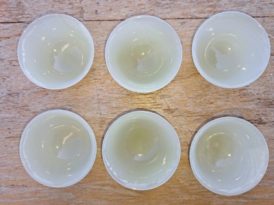 26769210a - 6-piece rice wine set made of jade, China, 20th century, 6 translucent green bowls, diameter 6.5 cm each