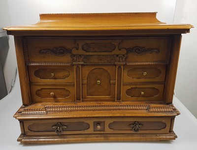 26769341b - Model cabinet cupboard, South German, 18th century, oak veneer, lid with drawer, behind it a lock for the lid drawer, old lock and fittings, former 2-door front is missing, 6 drawers, Renaissance decor, drawers mainly lined with marble paper, restored, 4 secondary feet, 29x36x26 cm, 1 key available