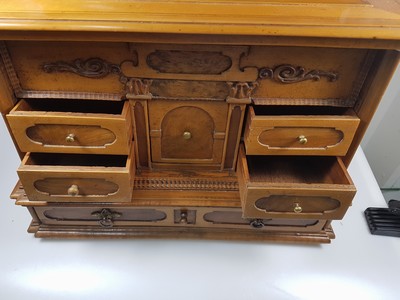 26769341h - Model cabinet cupboard, South German, 18th century, oak veneer, lid with drawer, behind it a lock for the lid drawer, old lock and fittings, former 2-door front is missing, 6 drawers, Renaissance decor, drawers mainly lined with marble paper, restored, 4 secondary feet, 29x36x26 cm, 1 key available
