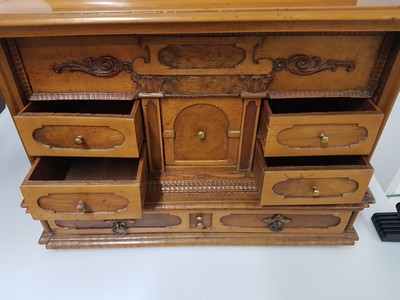 26769341o - Model cabinet cupboard, South German, 18th century, oak veneer, lid with drawer, behind it a lock for the lid drawer, old lock and fittings, former 2-door front is missing, 6 drawers, Renaissance decor, drawers mainly lined with marble paper, restored, 4 secondary feet, 29x36x26 cm, 1 key available
